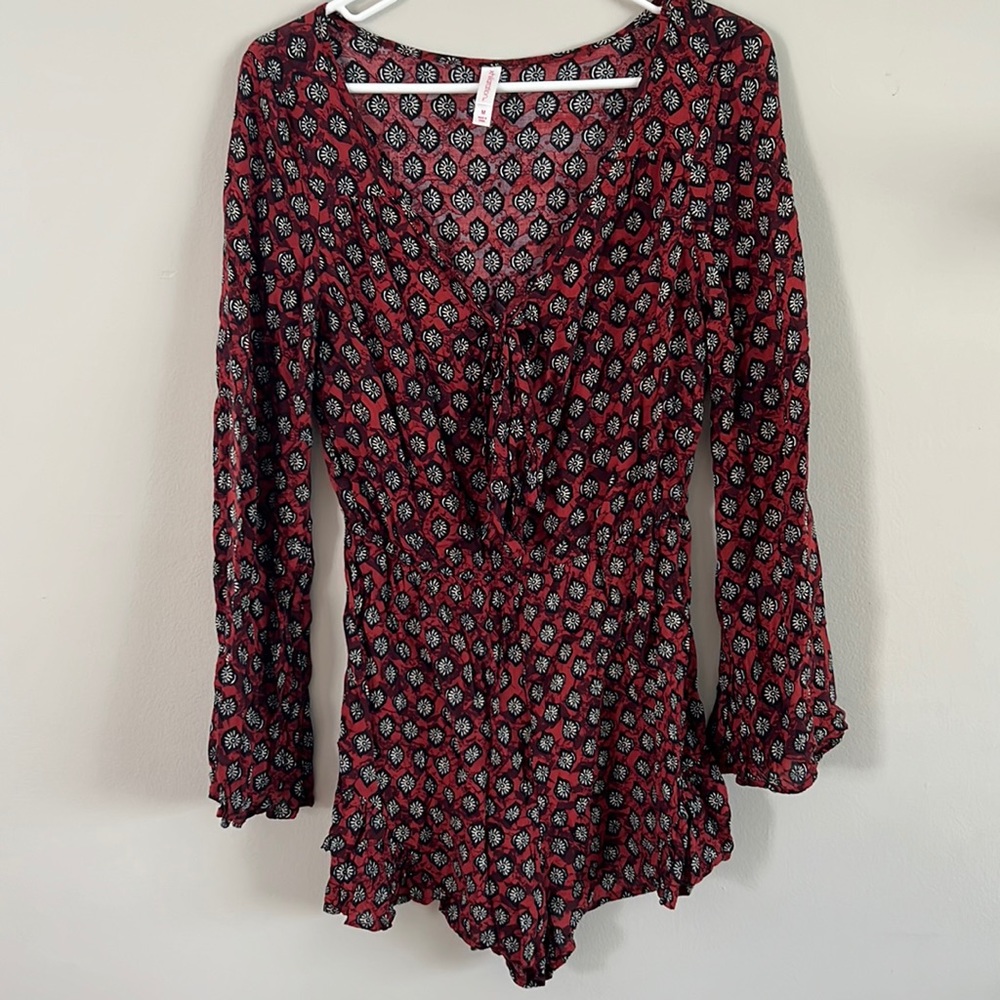Long bell sleeve shorts romper. Tie in front